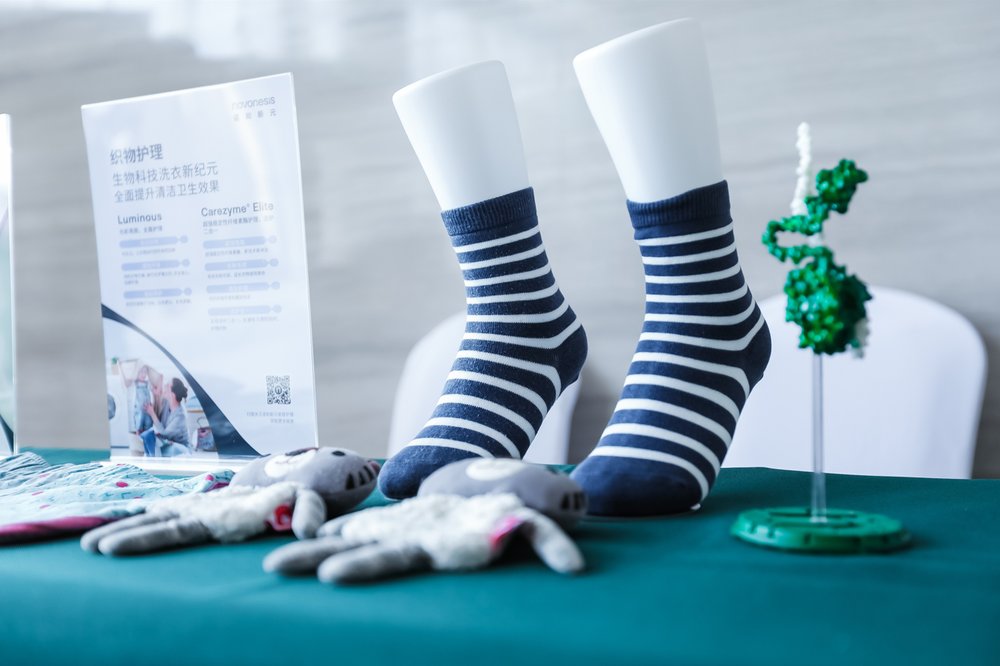 Two feet in striped socks on a tableDescription automatically generated Two feet in striped socks on a tableDescription automatically generated